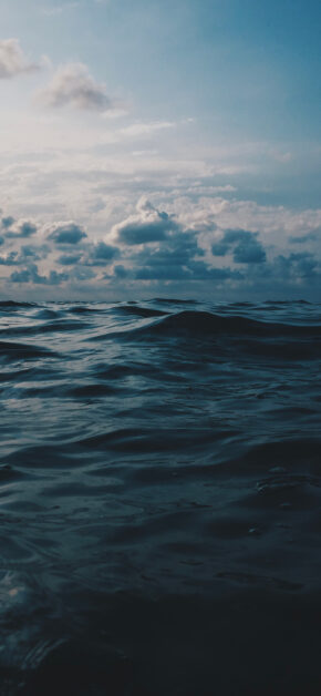 Dark ocean under a cloudy sky