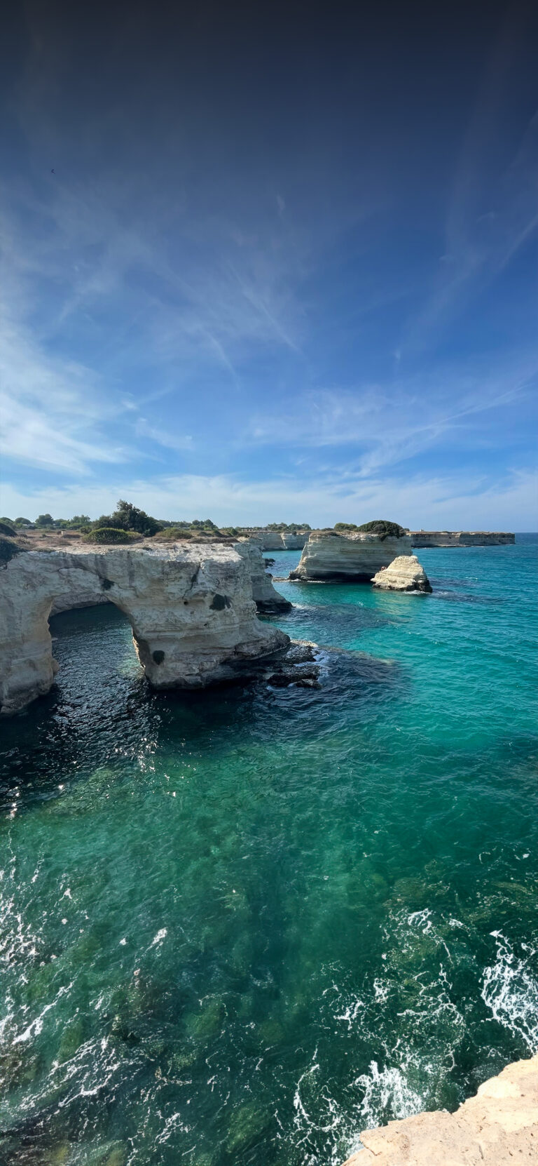 Default wallpaper of Faraglioni di Sant’Andrea, Puglia, Italy | Around the World